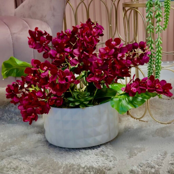 Ceramic vase with orchids